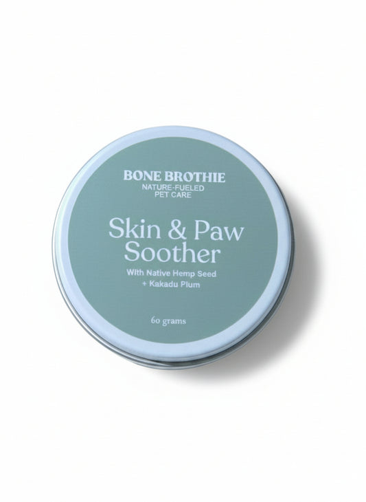 Tin of Bone Brothie Skin & Paw Soother on a light beige background