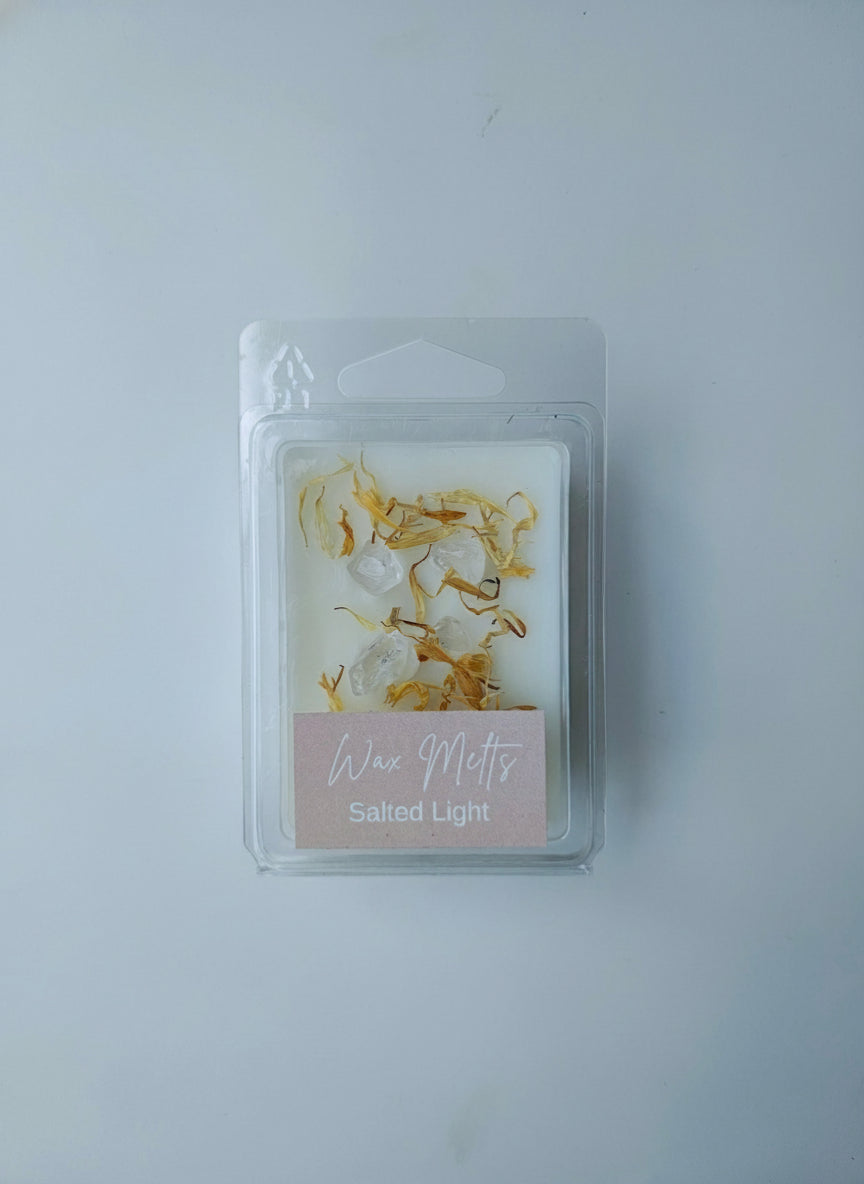 Packaged product with clear quartz and petalse on a plain background