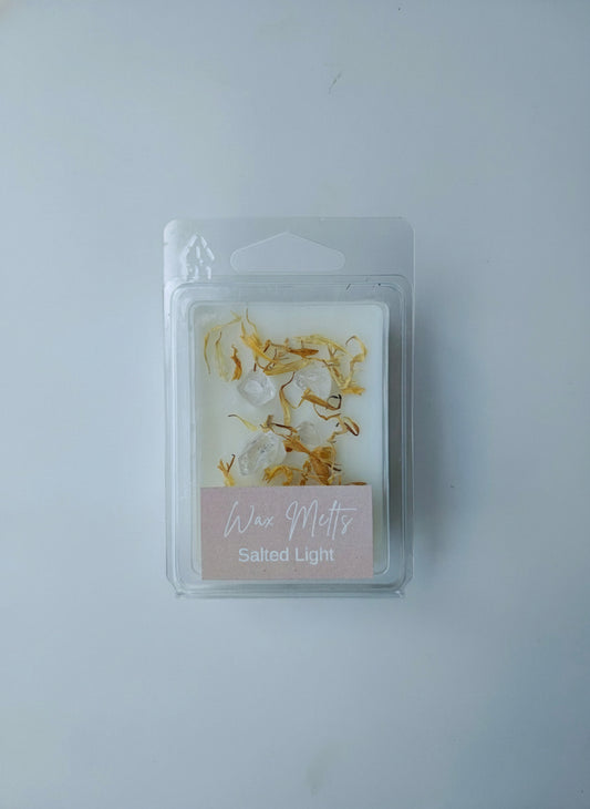 Packaged product with clear quartz and petalse on a plain background